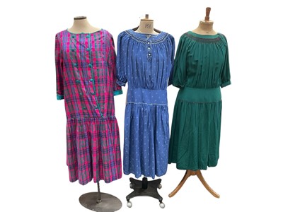 Lot 2559 - Designer Anna Belinda three 1980s dresses, tartan silk with front buttons and dropped waistline, green smocked silk with low waistline and similar blue silk with tiny printed leaves and button...