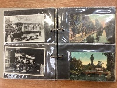 Lot 1160 - Postcards Colchester collection in four albums including many busy street scenes, trams, carriages,vigenettes, vehicles, shops, parade, castle exterior and interior, park, heraldic, Girl's High...