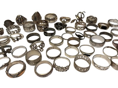Lot 137 - Collection of 50 silver and white metal rings including two buckle rings, a snake ring etc