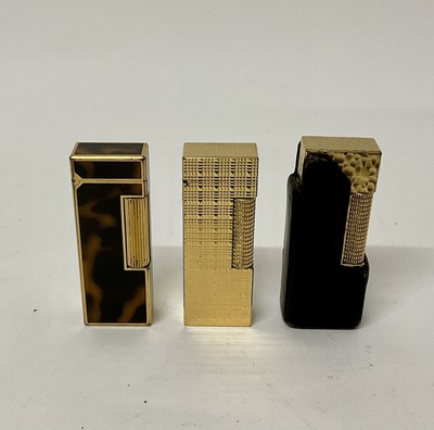 Lot 195 - Three Dunhill lighters