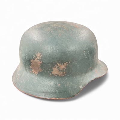 Lot 737 - Second World War Nazi German M40 pattern steel helmet, with original painted finish, stamped under brim '64', with tan leather liner stamped '53 - 57' and inscribed in ink POW Wagner B.