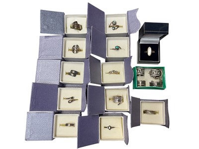 Lot 181 - Collection of various silver rings including cross-over rings, turquoise, labrodrite and mother of pearl, together with two marcasite rings with matching pairs of earrings, mostly boxed