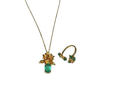 Lot 201 - Yellow metal emerald and diamond floral pendant on chain and a similar ring (2)