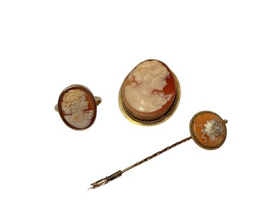 Lot 205 - Carved shell cameo depicting a female bust in 9ct gold brooch mount, together with a similar ring and stick pin (3)