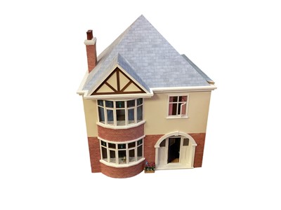 Lot 1943 - Dolls house two storey 1930's style wooden construction with bay windows, front and side openings complete with furnishing.
