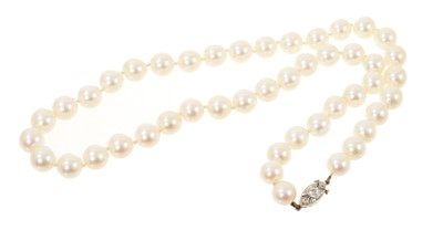 Lot 472 - Cultured pearl necklace with a white gold old cut diamond set clasp