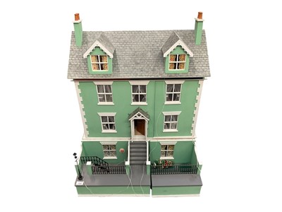 Lot 1948 - Dolls house four storey town house, wooden construction painted green and white, with railings and lamp post. Front opening, furnishings, accessories and figures.