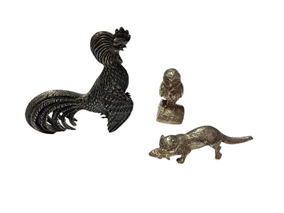 Lot 217 - Contemporary silver model of an otter, (London 1975), together with a silver owl and a Spanish silver cockerel, all at 2.8ozs, cockerel 5.8cm in height, (3).