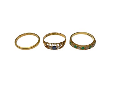 Lot 237 - 18ct gold diamond and emerald nine stone half eternity ring, Edwardian 18ct gold sapphire, diamond and synthetic stone ring (two stones missing) and 18ct gold wedding ring (3)