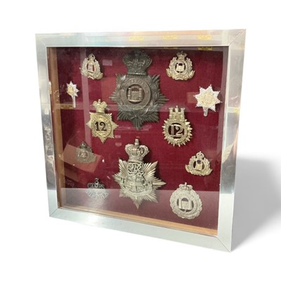 Lot 767 - Group of twelve assorted Victorian and later helmet plate and cap badges to include Victorian Suffolk 1st Volunteer Battalion Helmet Plate, Victorian Cambridge University Volunteer Rifles Helmet...