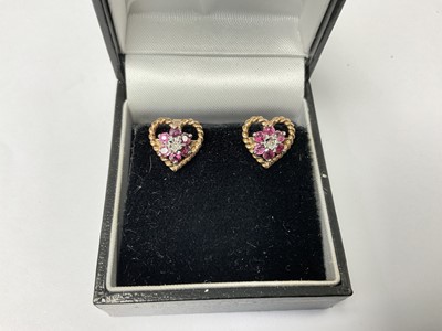 Lot 200 - Pair of ruby and diamond heart shape earrings in 9ct gold setting, 10mm.