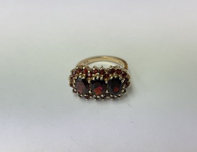 Lot 206 - Victorian style 9ct gold garnet cluster ring with a triple cluster of garnets in claw setting on 9ct gold shank. London 1975.
