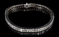 Lot 546 - Fine diamond line bracelet by Adler, the...