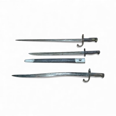 Lot 836 - First World War 1907 pattern Enfield bayonet (sharpened for active service), in scabbard, together with a French 1866 pattern Chassepot bayonet and a French 1874 pattern Gras bayonet, (both with...
