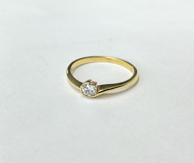 Lot 209 - Diamond single stone ring with a brilliant cut diamond estimated to weigh approximately 0.15ct, in 18ct gold cross-over setting. London 2000.