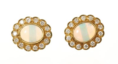 Lot 491 - Pair of opal and diamond cluster earrings in 18ct gold settings