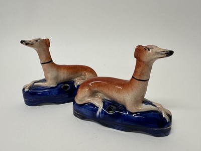 Lot 108 - Pair of Victorian Staffordshire pottery greyhound pen stands/inkwells, 9.5cm high