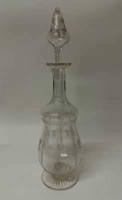 Lot 117 - Good quality Edwardian glass decanter with etched foliate garlands, on circular star cut base, 38cm high