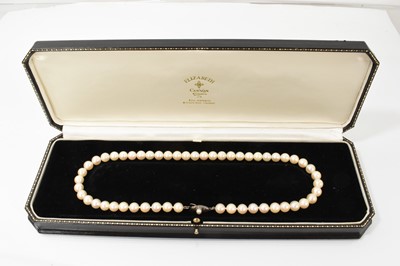 Lot 115 - Cultured pearl necklace with a string of 7.7mm pearls, on a silver clasp, 43cm length.
