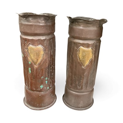 Lot 779 - Pair of First World War Trench Art shell case vases, each with applied shield shaped cartouch 'Souvenir of the Great War', 22cm in overall height.