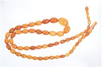 Lot 557 - Old amber necklace with a string of graduated...