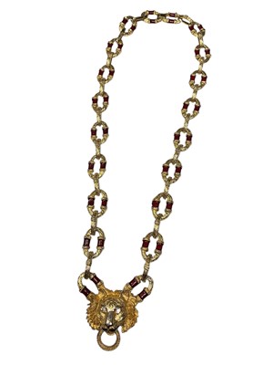 Lot 272 - 1960s Kenneth Jay Lane gilt metal and red enamel necklace with a lion mask pendant and large oval links, marked K.J.L. 76cm long