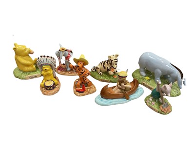 Lot 2356 - Group of 8 Royal Doulton Winnie the Pooh figures including four from the Wild West Collection (7 with boxes)