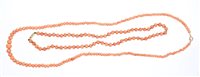 Lot 562 - Two old coral bead necklaces - one with...