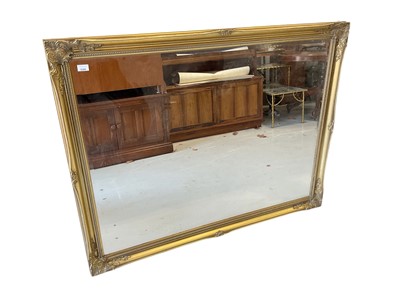Lot 5390 - Decorative gilt framed wall mirror with bevelled plate 105 x 136cm
