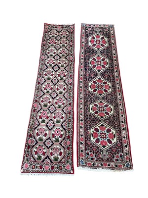 Lot 5405 - Pair of Persian runners on red and cream ground. Measurements 240cm x 54cm and 235cm x 61cm