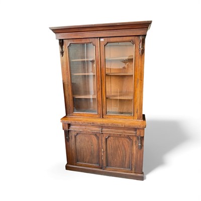 Lot 5399 - Victorian mahogany two height bookcase with two glazed doors above and two frieze drawers and two panelled doors below on platform base 209cm high, 120cm wide , 43cm deep
