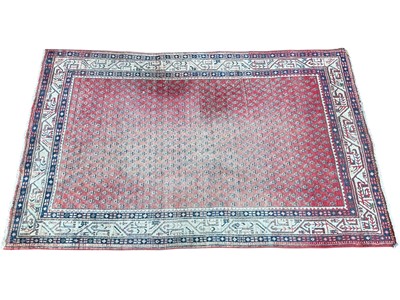 Lot 5406 - Persian rug on red and cream ground. Measurements 202cm x 126cm