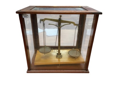 Lot 3026 - Set of 20th century brass chemical balance scales in a glazed mahogany case.