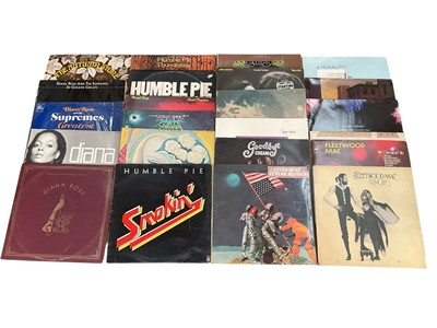Lot 2759 - Two boxes of LP records including Mountain, Fleetwood Mac, Yes, Uriah Heep, Dire Straits, Steppenwolf, Blalck Sabbath, Queen, compliations and ABBA etc. Two bags of singles included. Conditions...