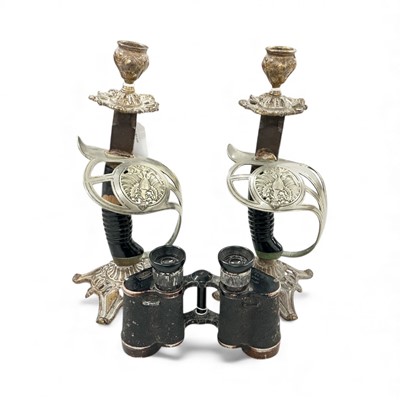 Lot 792 - Pair of First World War era candlesticks constructed from Prussian sword hilts, together with a pair of German field glasses, (3).