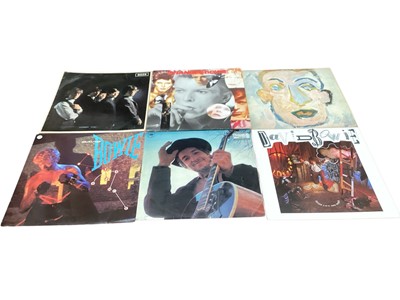 Lot 2706 - Vintage case of LP records including Eric Clapton, the Nice, Rolling Stones, Bob Dylan and David Bowie. Also included is 'Rolling Stones Complete' - published by Omnibus Press. Vinyl appears ver...