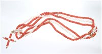 Lot 574 - Coral bead and cultured pearl three-strand...