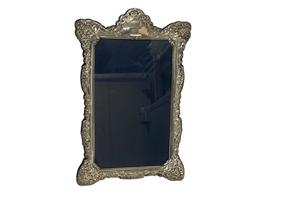 Lot 178 - Large silver photograph frame (Sheffield 1992) of rectangular form with scroll borders and easel support, 37cm x 24.5cm overall.