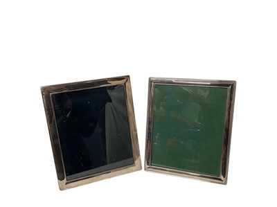 Lot 182 - Two large silver plated photograph frames of rectangular form with easel supports
