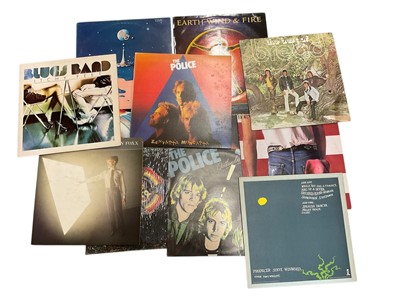 Lot 2717 - Two canvas bags of LP records and video discs including Electric Light Orchestra, The Police, Bruce Springsteen, Steve Winwood, Emerson, Lake and Palmer, Ian Dury, Ray Charles, Roxy Music, Human...