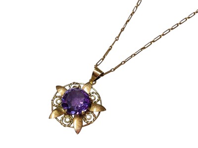 Lot 317 - Eastern yellow metal and faux alexandrite flower shaped pendant on 9ct gold chain