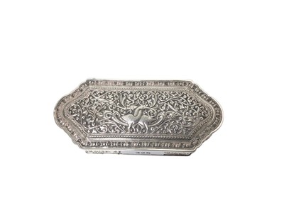 Lot 325 - Indian white metal box with hinged lid and embossed floral scroll and bird decoration