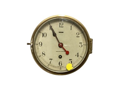 Lot 3067 - Mid 20th century brass ships bulkhead clock by Kelvin Hughes, case 17cm in diameter.