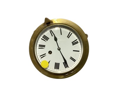 Lot 3068 - Late 19th / early 20th century brass ships bulkhead clock with white enamel dial, case 15.7cm in diameter.