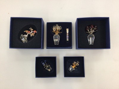 Lot 2386 - Eleven Swarovski Crystal flower ornaments, all boxed