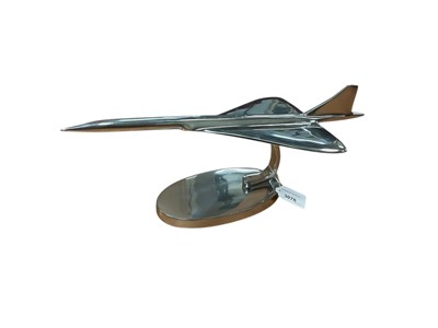 Lot 3076 - Contemporary polished metal aircraft model in the form of Concorde, 41.5cm in length.