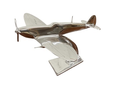 Lot 808 - Contemporary polished metal aircraft model in the form of Supermarine Spitfire, 30cm in length.