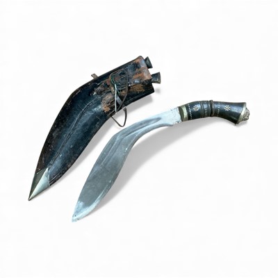 Lot 867 - Old Gurkha kukri with in leather covered sheath, blade 28cm in length.