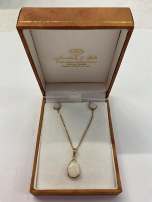 Lot 985 - Opal pear shaped pendant in 14ct gold mount on 9ct gold chain, together with a pair of similar earrings