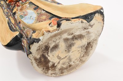 Lot 32 - Large antique Japanese Satsuma figure of an Immortal, brightly decorated, 49cm high